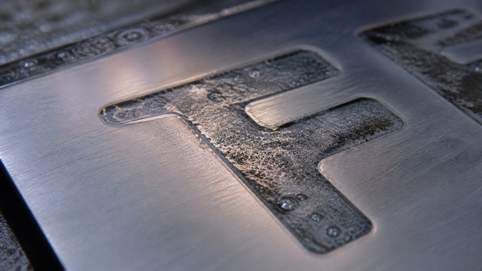 salt water etching stainless steel close up electrolysis metal engraving process
